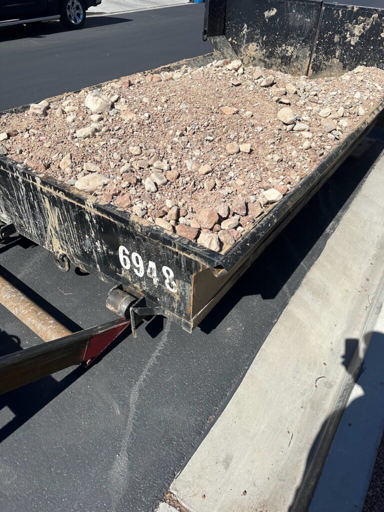 6 yard lowboy dumpster filled with rock, Las Vegas.