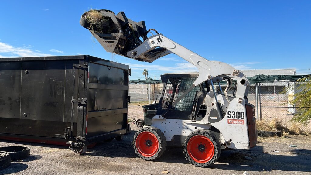 Las Vegas skid steer loading dumpster