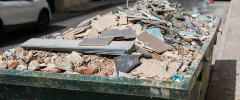 Dumpster overfilled with construction debris