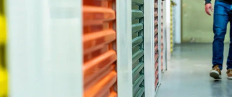 Man walking through an indoor storage facility