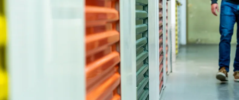Man walking through an indoor storage facility
