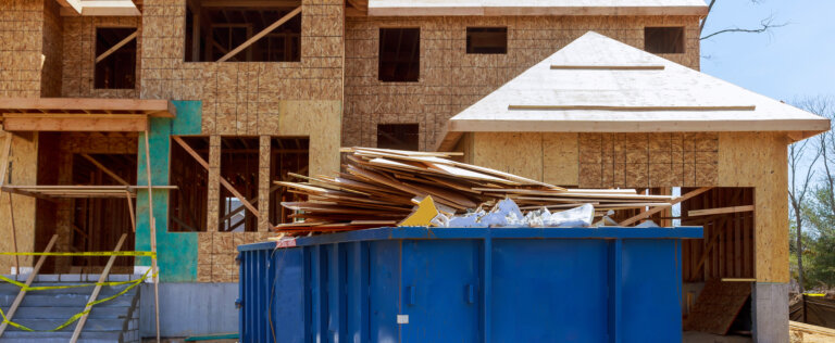 Truck loading a full recycling container trash dumpsters being with garbage container trash