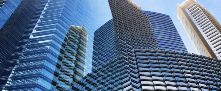 Modern glass skyscraper building abstract - with part behind a glass panel and part exposed. Las Vegas, Nevada, 2013.