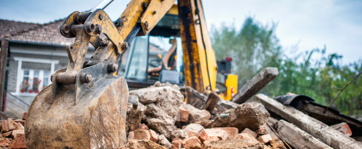 Hydraulic crusher excavator backoe machinery working on site demolition